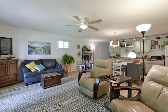 22016 Waters Edge Dr, Shell Knob, MO 65747 - living room with light wood finished floors and a ceiling fan