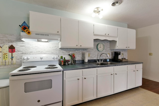 kitchen featuring tasteful backsplash, light tile patterned flooring, sink, white range with electric cooktop, and white cabinets