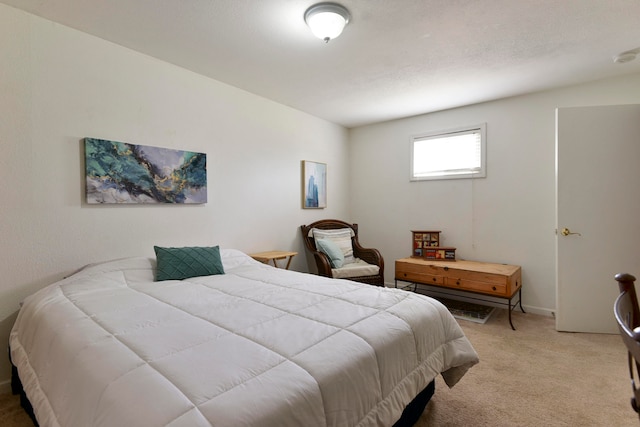 bedroom featuring light colored carpet