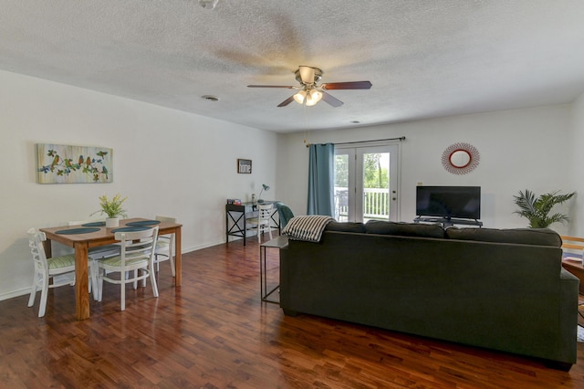 22016 Waters Edge Dr, Shell Knob, MO 65747 - living room with dark wood-style floors, visible vents, a ceiling fan, baseboards, and a textured ceiling