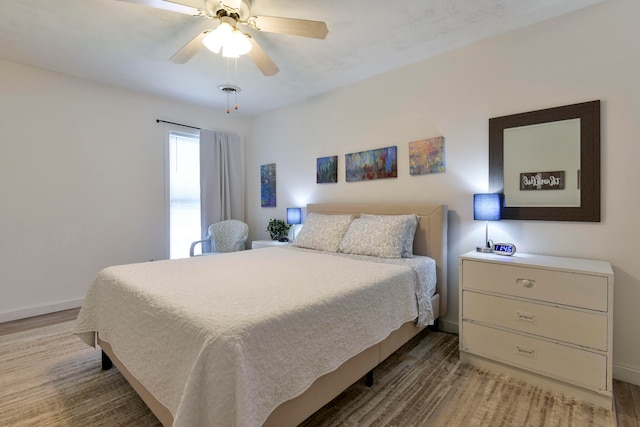 bedroom featuring ceiling fan and light wood-type flooring