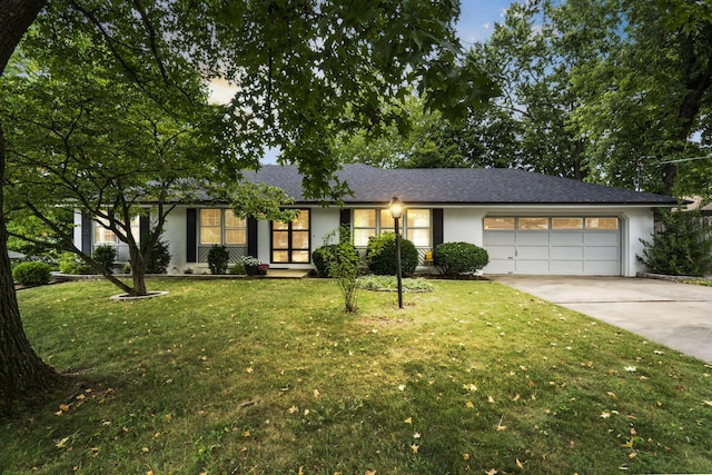 ranch-style house with a front lawn and a garage