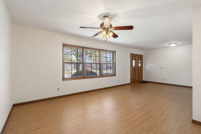 unfurnished room with ceiling fan and light hardwood / wood-style floors