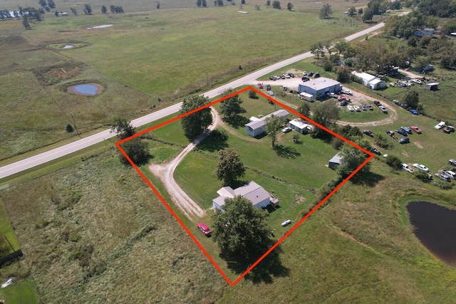 bird's eye view featuring a rural view and a water view