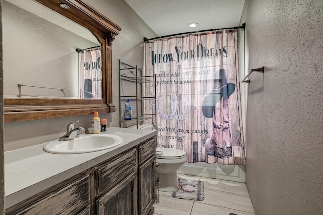 full bathroom with shower / bathtub combination with curtain, vanity, and toilet