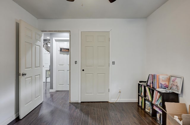 bedroom with ceiling fan and dark hardwood / wood-style floors