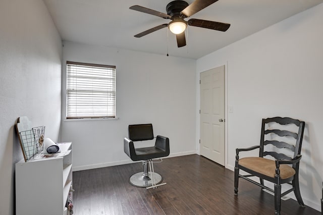 living area with ceiling fan and dark hardwood / wood-style floors