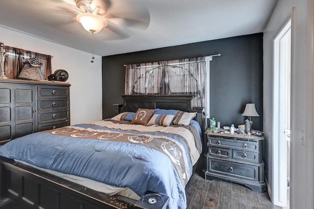 bedroom featuring ceiling fan and dark hardwood / wood-style flooring