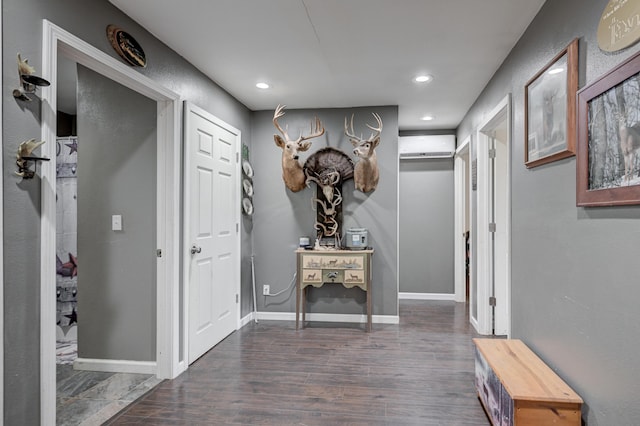 corridor featuring baseboards, dark wood-style floors, and recessed lighting