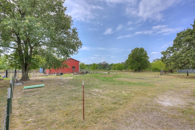 view of yard with a rural view