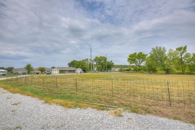 view of yard with a rural view