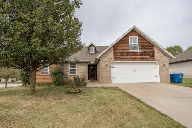 view of front of property featuring a garage and a front yard