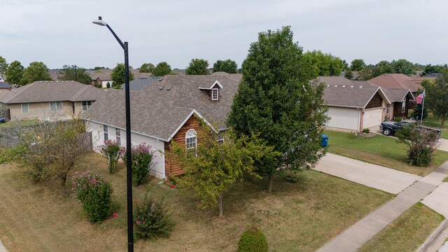 ranch-style home with a front lawn