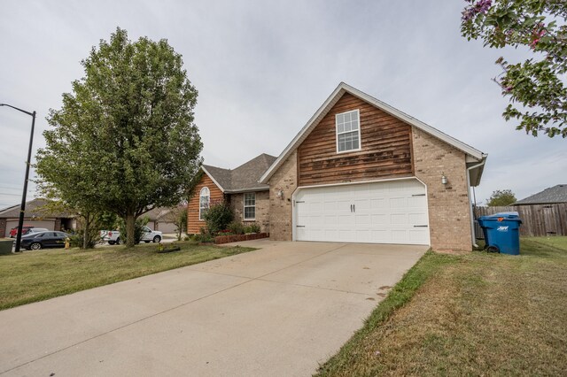 view of front of home featuring a front lawn and a garage