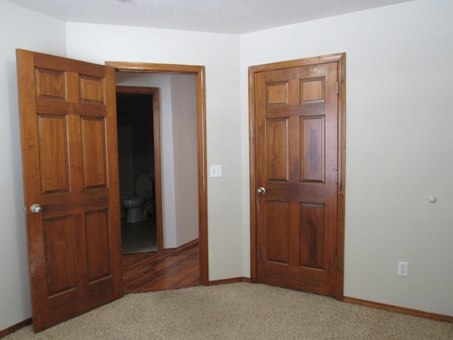 unfurnished bedroom featuring carpet flooring