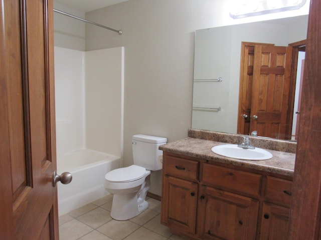 full bathroom featuring toilet, vanity, tile patterned floors, and  shower combination