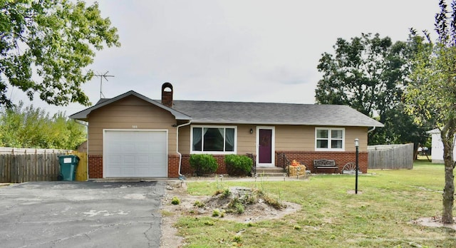 ranch-style house with a front yard and a garage