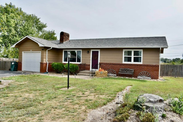 ranch-style house featuring a front yard and a garage