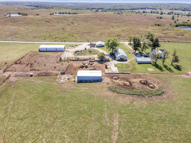 birds eye view of property with a rural view