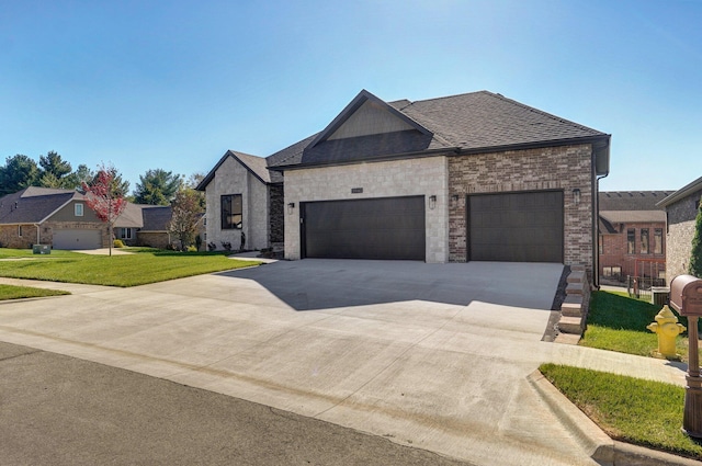 3940 E Ridgeview St, Springfield, MO 65809 - view of front of home with an attached garage, driveway, a front lawn, brick siding, and roof with shingles