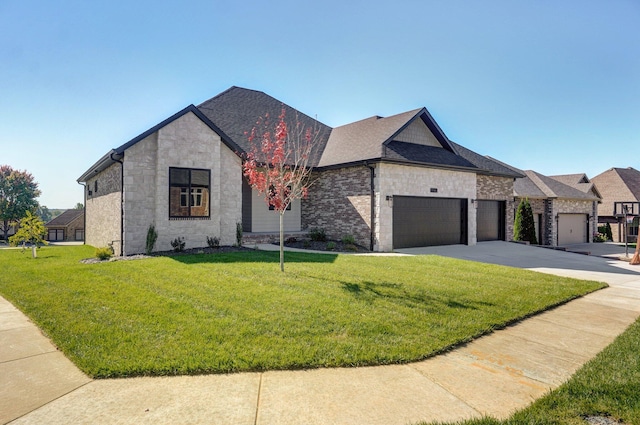 french provincial home featuring a front lawn and a garage