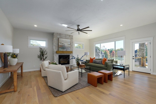 3940 E Ridgeview St, Springfield, MO 65809 - living area with a stone fireplace, light wood finished floors, plenty of natural light, recessed lighting, and ceiling fan