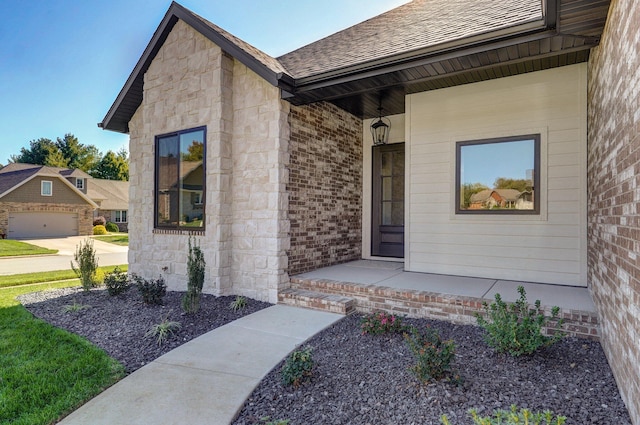 view of exterior entry featuring a garage