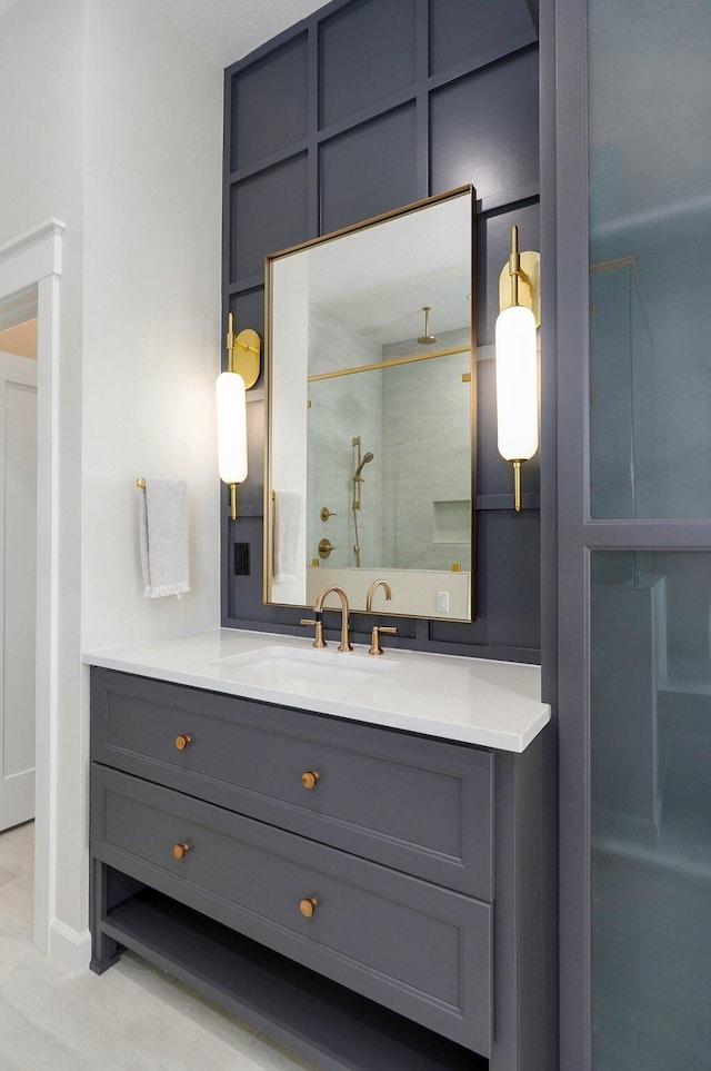 bathroom featuring vanity and a shower