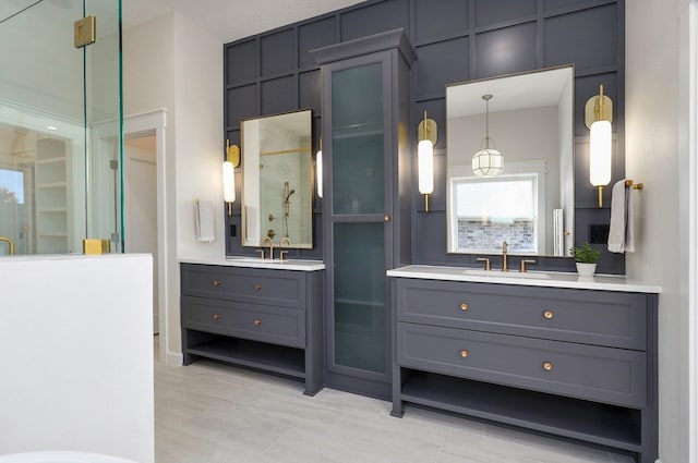 3940 E Ridgeview St, Springfield, MO 65809 - bathroom featuring a stall shower and two vanities
