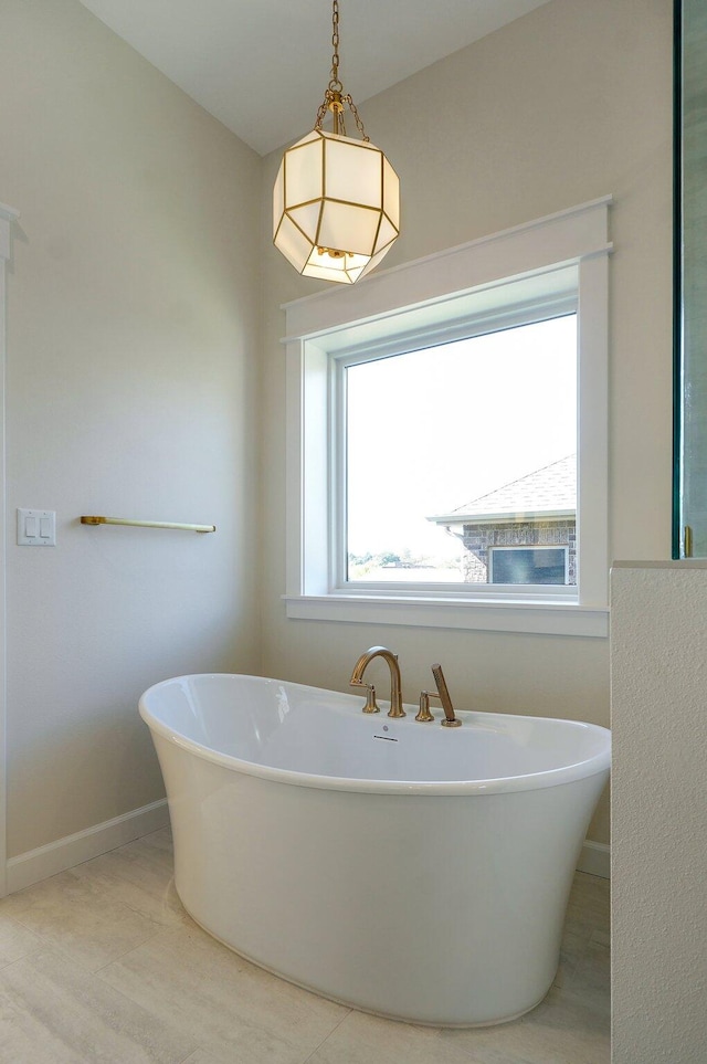 bathroom featuring a tub to relax in