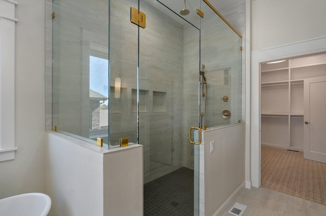 3940 E Ridgeview St, Springfield, MO 65809 - full bath featuring a stall shower, a spacious closet, and a freestanding tub