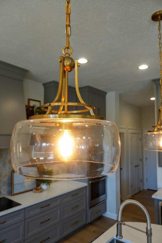 room details with a textured ceiling and sink