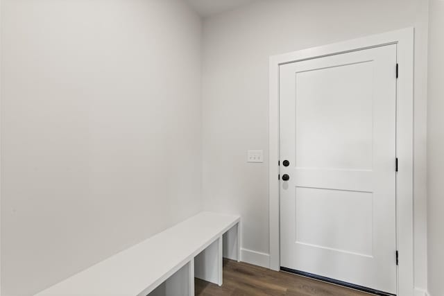 mudroom with baseboards and dark wood-style flooring