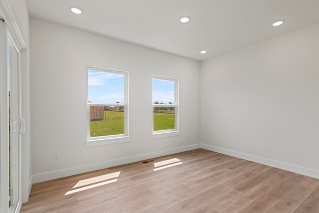 unfurnished room featuring light hardwood / wood-style floors