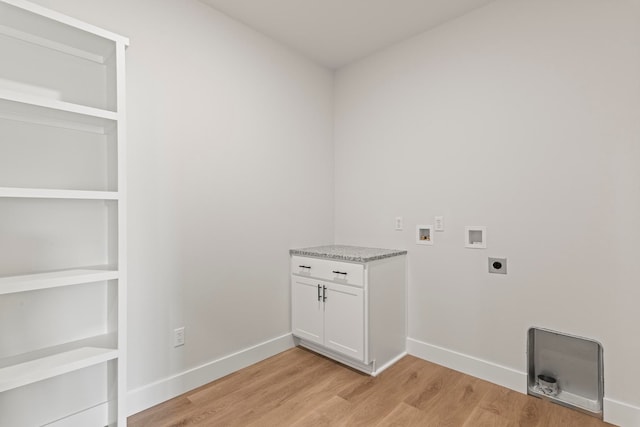 clothes washing area featuring hookup for an electric dryer, hookup for a washing machine, and light wood-type flooring