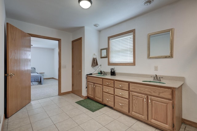 bathroom with tile patterned flooring and vanity