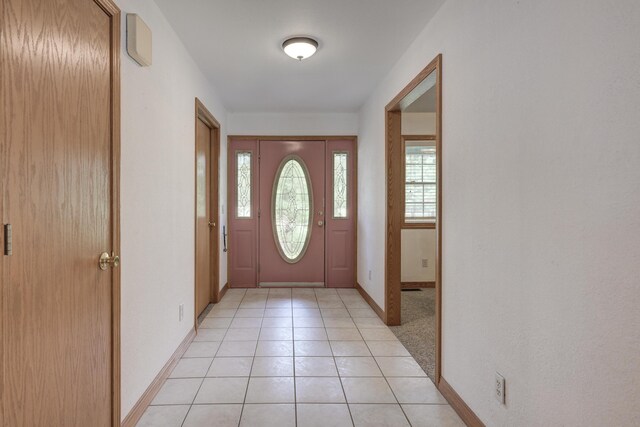 entrance foyer featuring light tile patterned floors