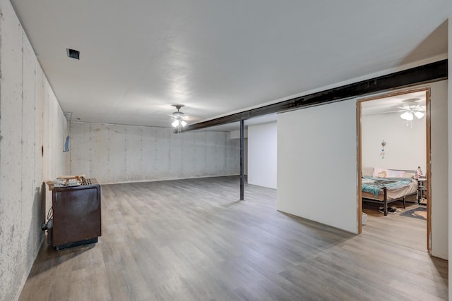 basement with wood-type flooring