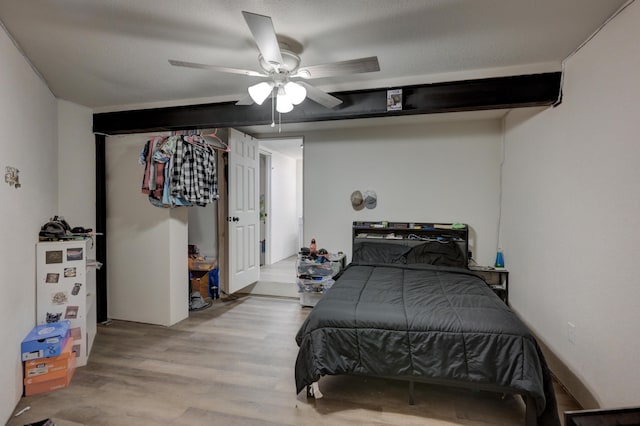 bedroom with light hardwood / wood-style floors and ceiling fan