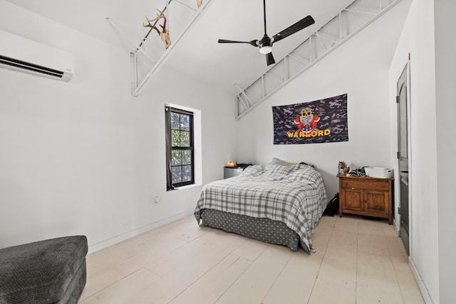 bedroom with an AC wall unit, light hardwood / wood-style floors, and ceiling fan