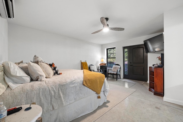 bedroom featuring a wall mounted AC and ceiling fan