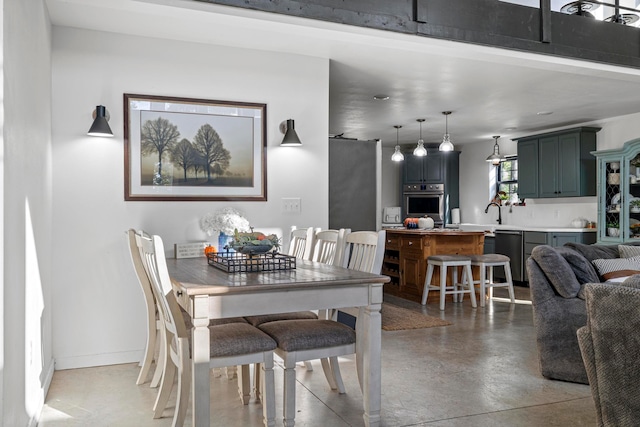 dining area with concrete flooring