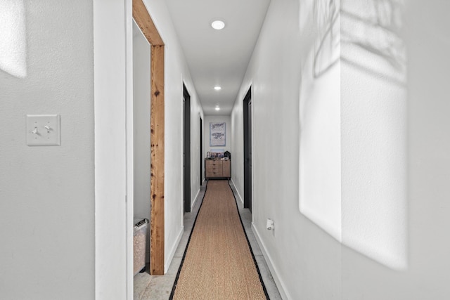 corridor with light wood-type flooring