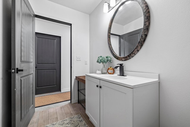 bathroom featuring vanity and hardwood / wood-style flooring