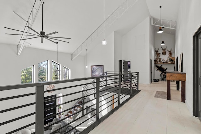 corridor featuring high vaulted ceiling