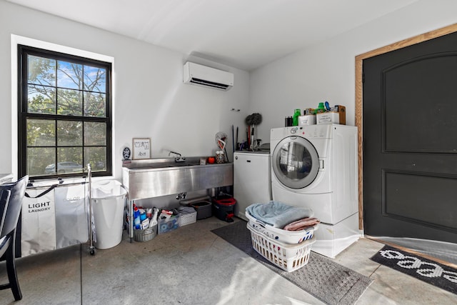 laundry room featuring independent washer and dryer and a wall mounted AC