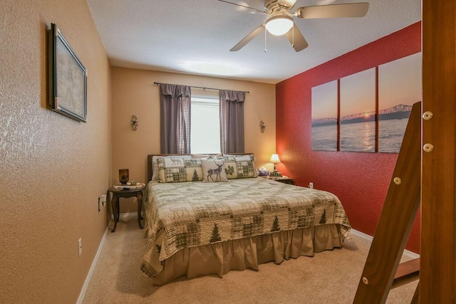 1007 Rocky Shore Ter, Kimberling City, MO 65686 - carpeted bedroom with a textured wall, a ceiling fan, and baseboards