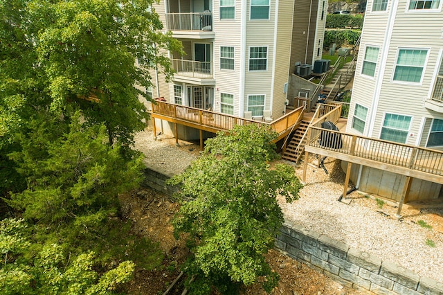 exterior space with cooling unit and a wooden deck