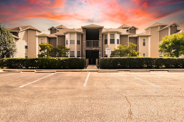 view of outdoor building at dusk