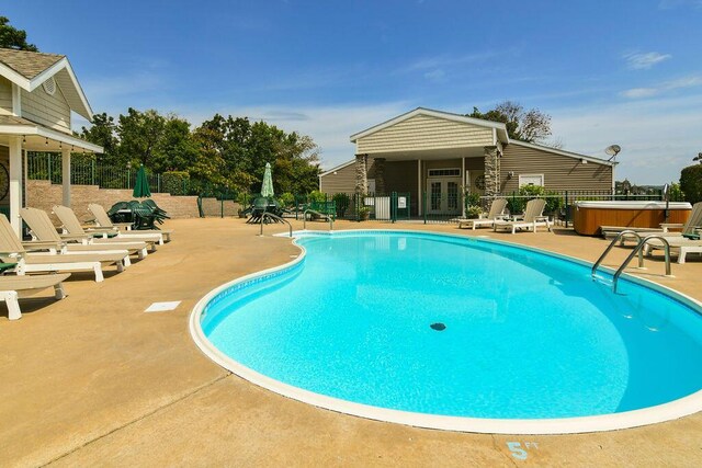 1007 Rocky Shore Ter, Kimberling City, MO 65686 - community pool with fence, french doors, a hot tub, and a patio